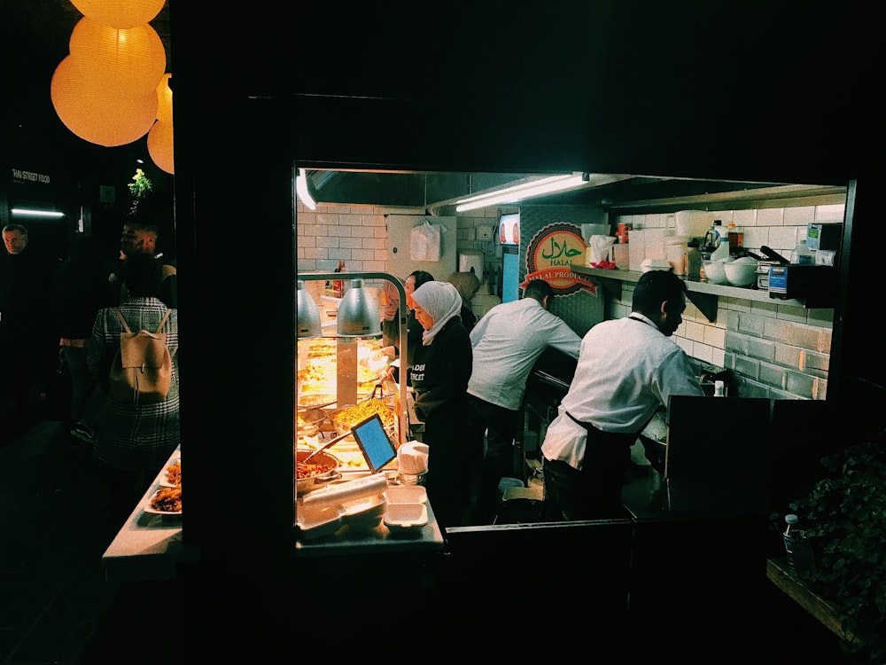 men cooking in kitchen