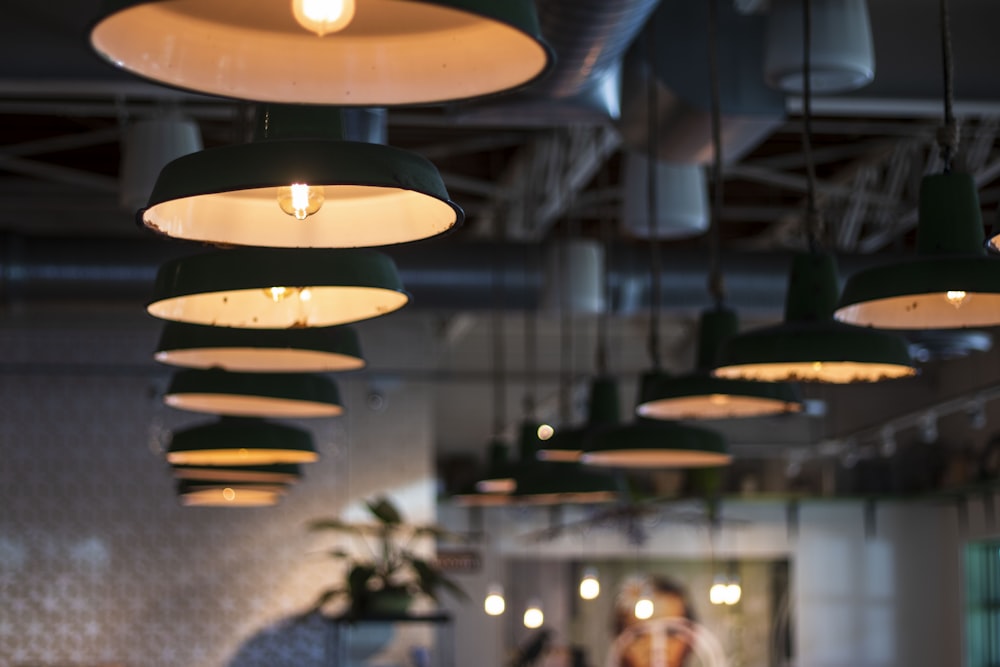 shallow focus photo of black pendant lamps