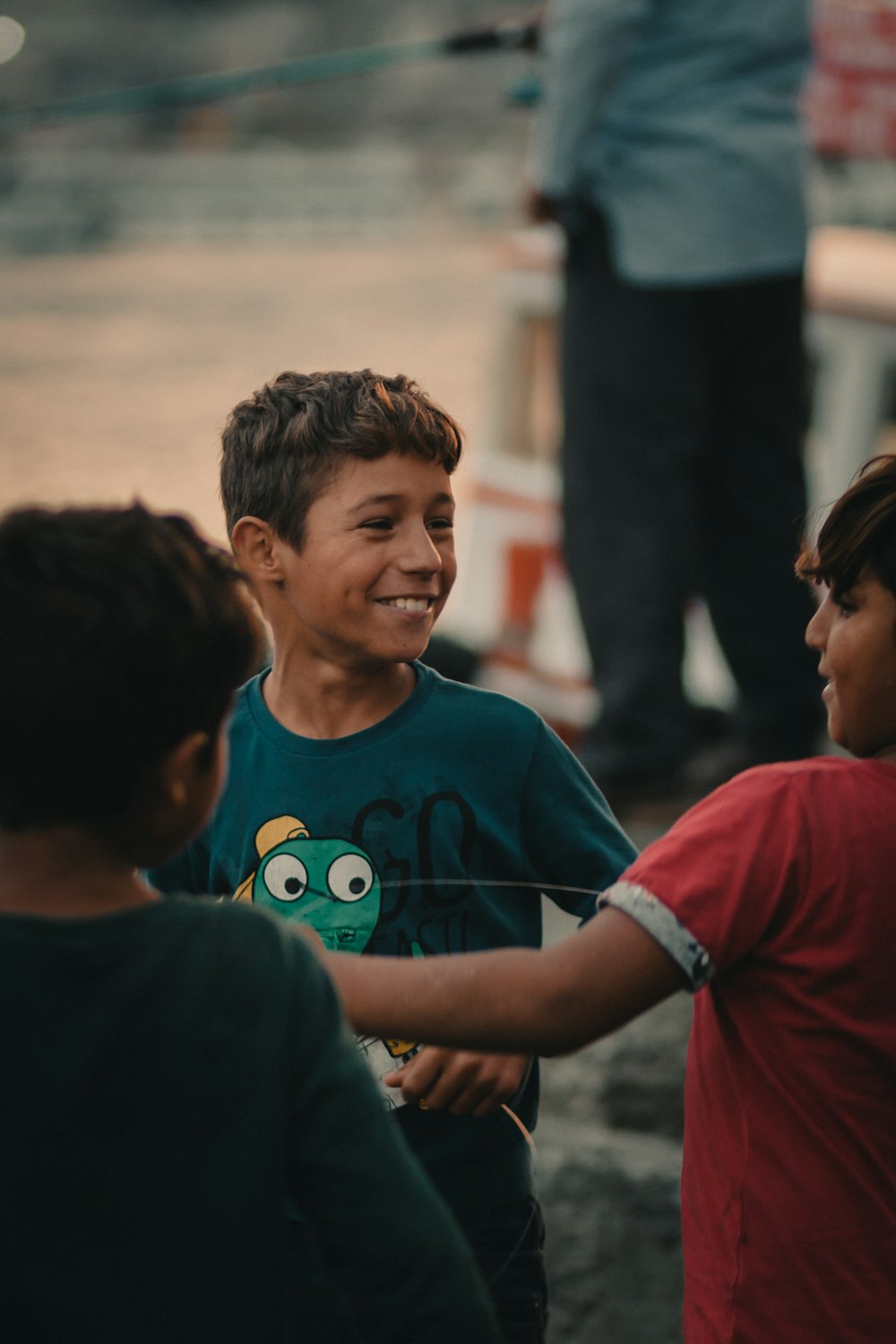 boy wearing green crew-neck shirt