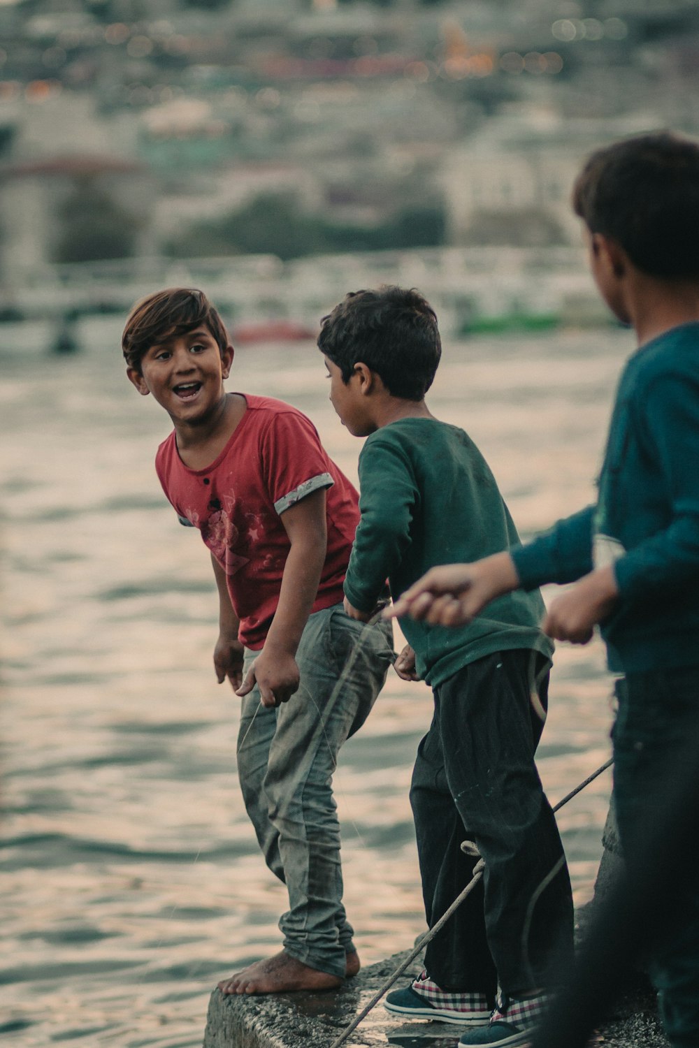 shallow focus photo of boy in red crew-neck T-shirt