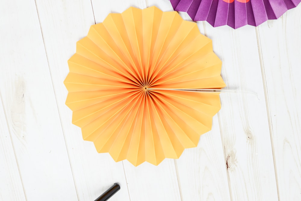 yellow paper flower fan on the wall