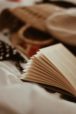 open book and wicker bag