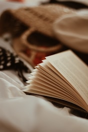 open book and wicker bag