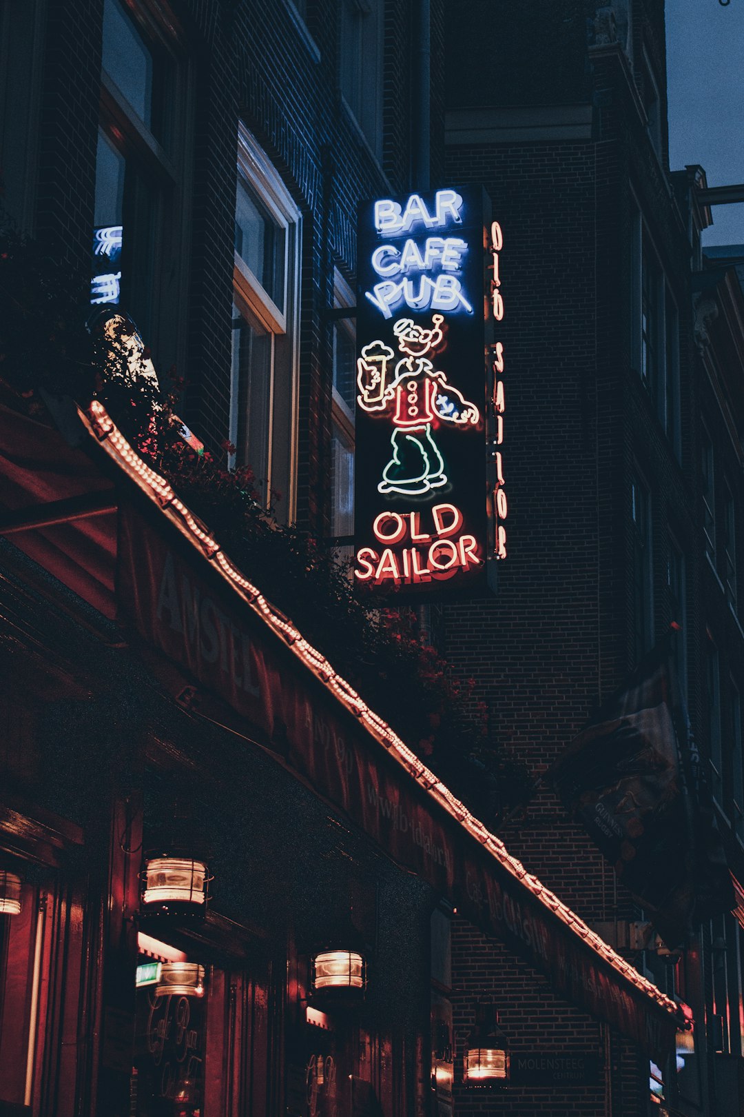 shallow focus photo of lighted bar cafe pub signage