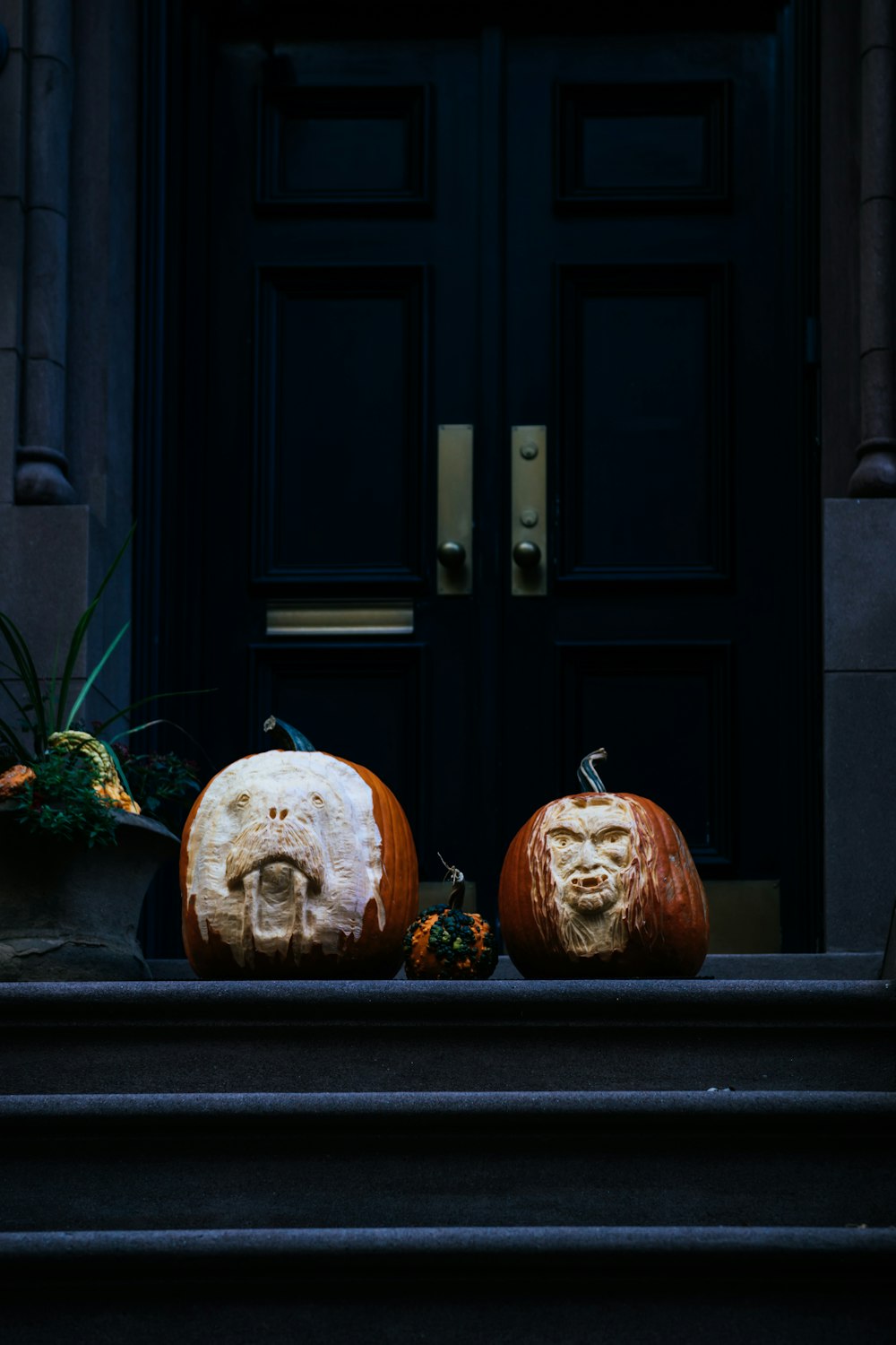 orange and brown pumpkin decors on stairs