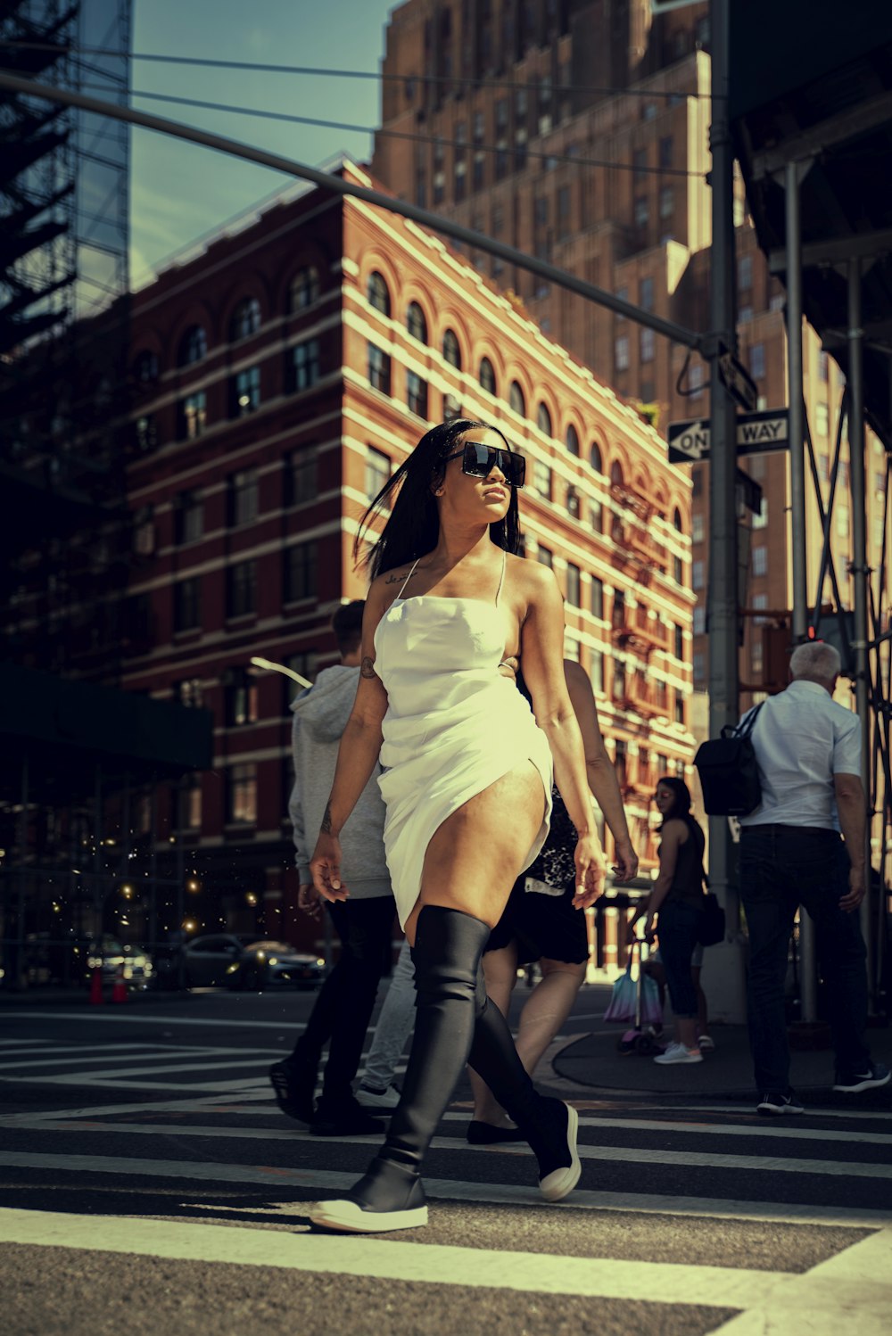 woman walking on pedestrian lane