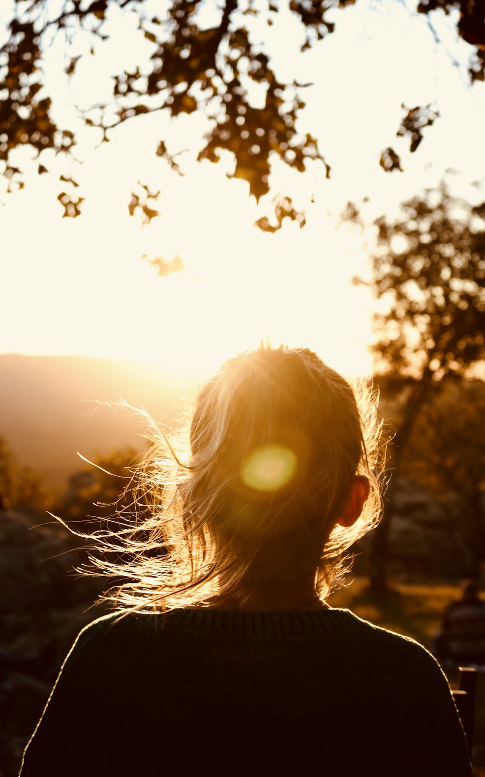 woman under orange sky