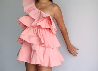 woman in pink one-shoulder dress