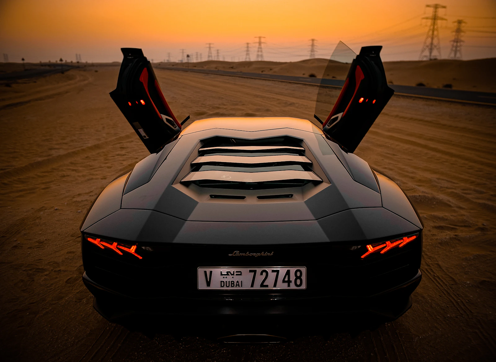 Polished grey supercar, hand-detailed and ready for handoff