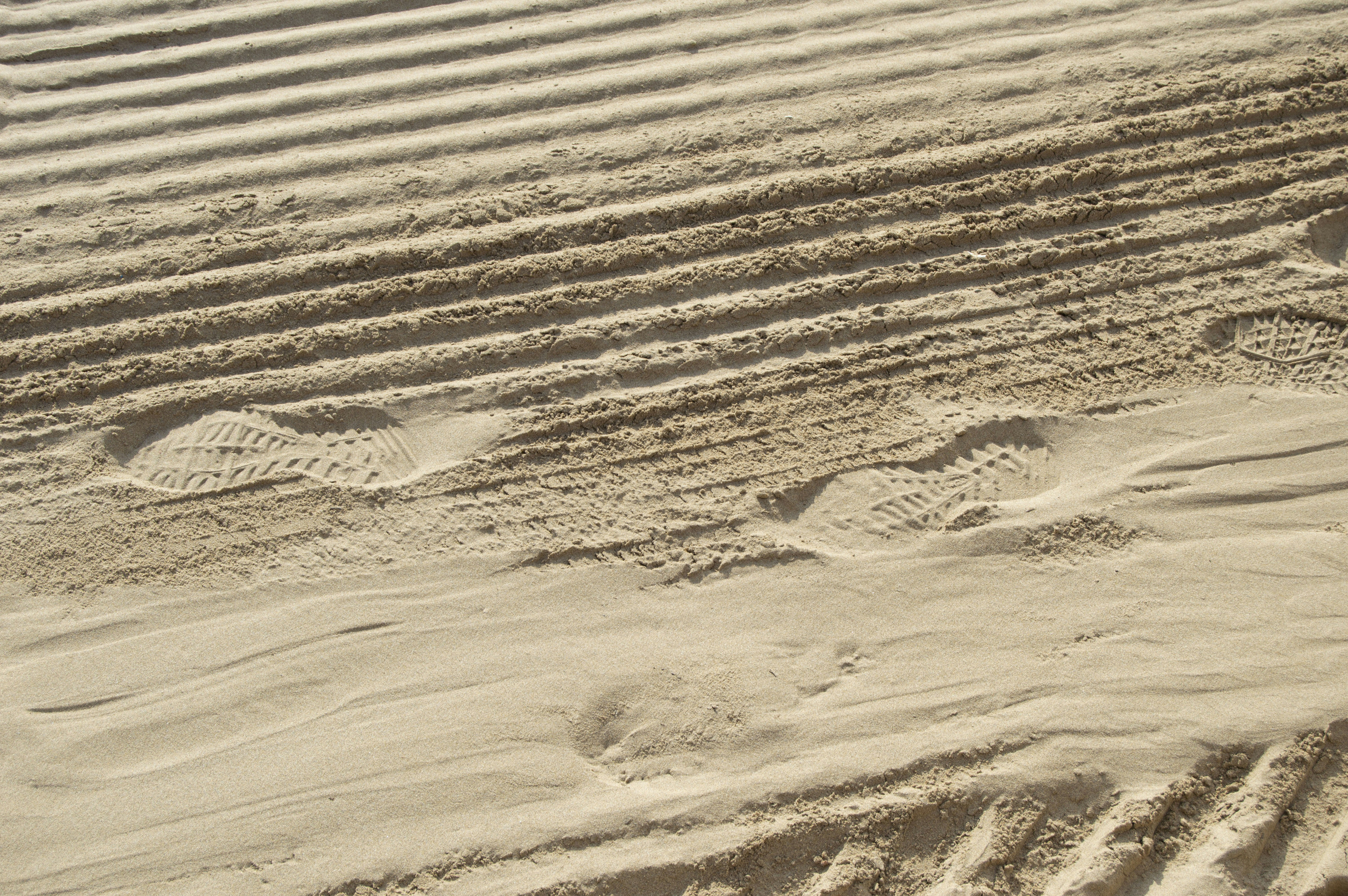 footprints on sand conceptual teams background