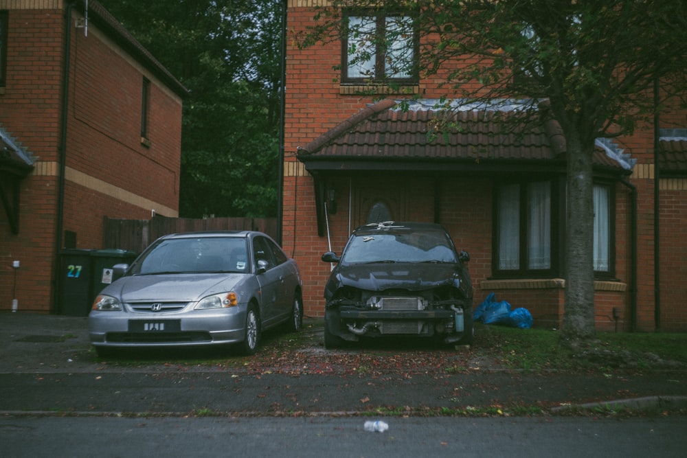 silver vehicle beside broken car