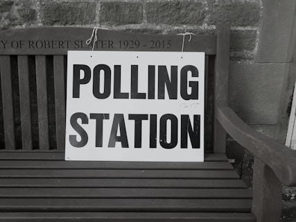 bench with polling station sign