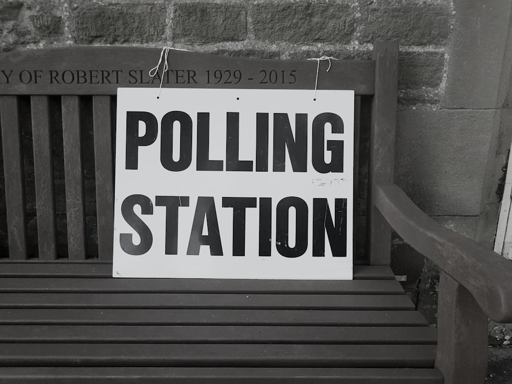 bench with polling station sign