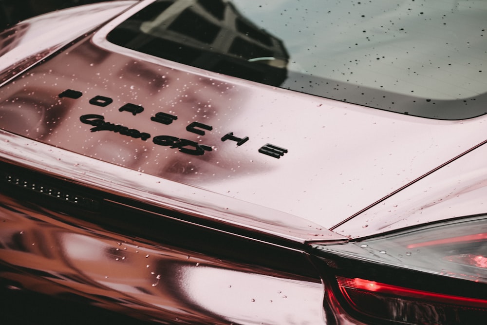a close up of a car with the word porsche on it