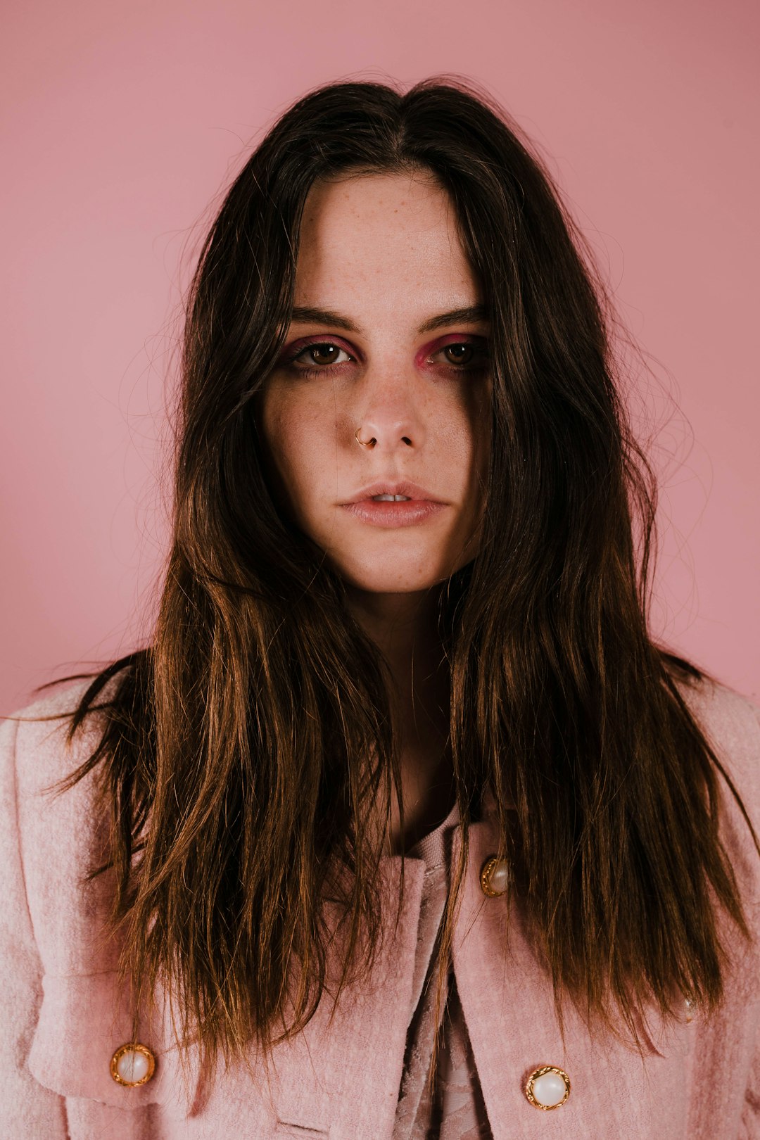 woman wearing pink button-up blazer