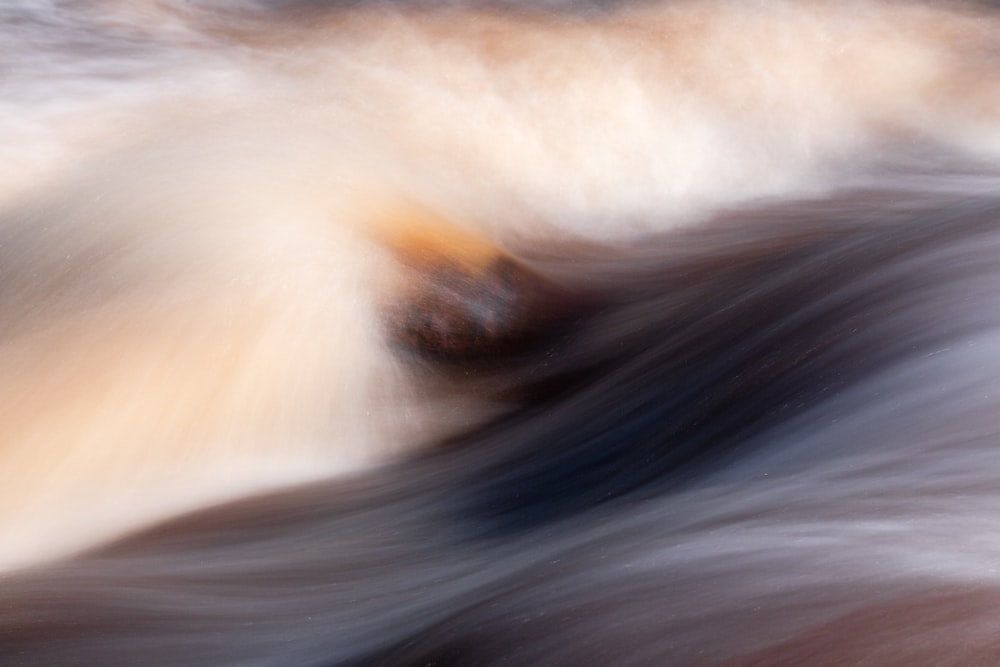 a blurry photo of water and rocks