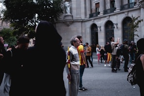 A photo capturing a group of visitors engaging with embassy staff during an open house day.