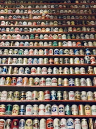 assorted-brand beverage can lot on rack