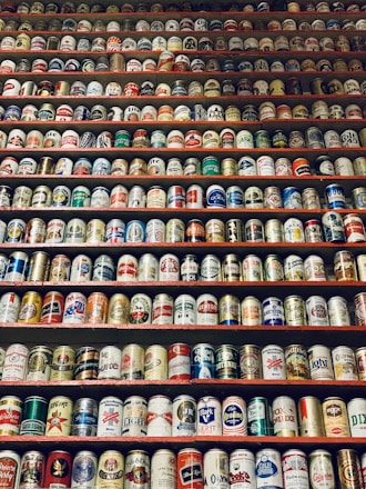 assorted-brand beverage can lot on rack