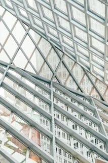 Structural glazing on a commercial facade with spider fittings holding large glass panels
