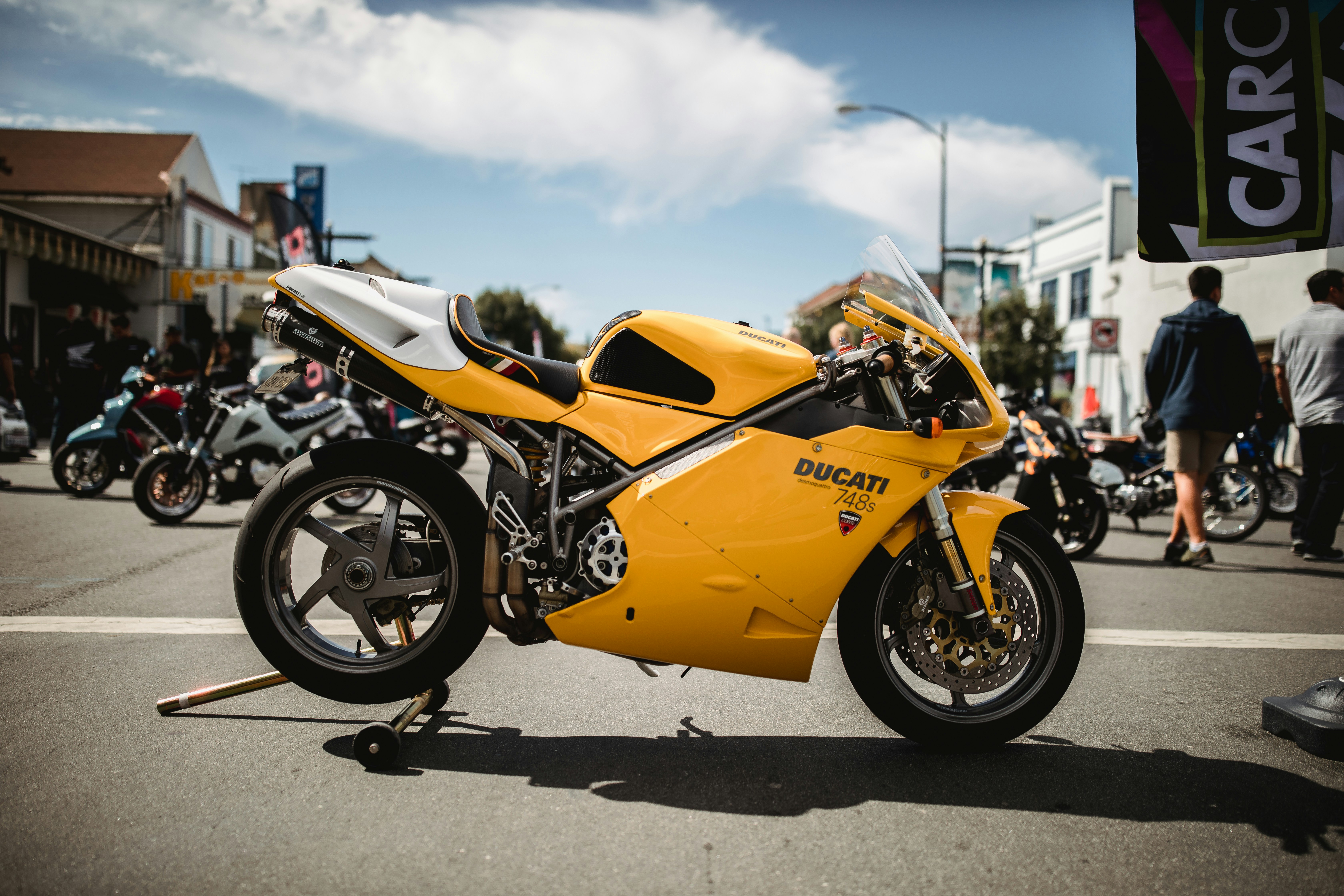 yellow and black Suzuki sports bike