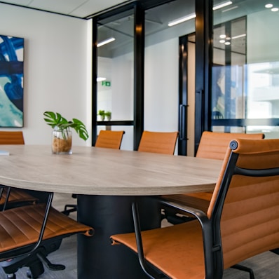 brown wooden 9-piece office table and chairs