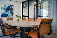 brown wooden 9-piece office table and chairs