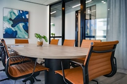 brown wooden 9-piece office table and chairs