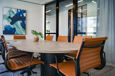 brown wooden 9-piece office table and chairs