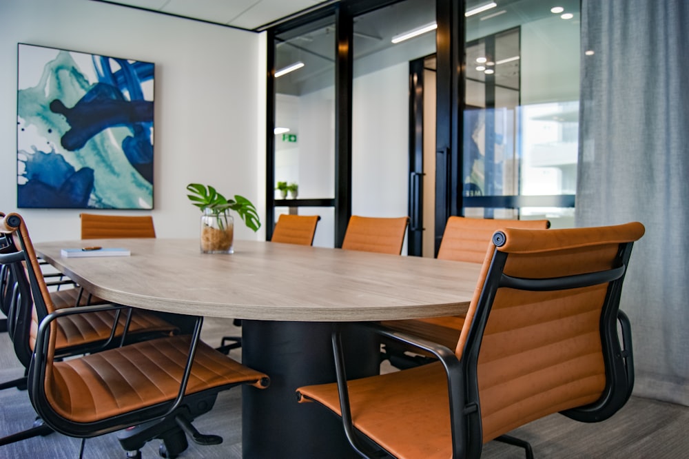 brown wooden 9-piece office table and chairs