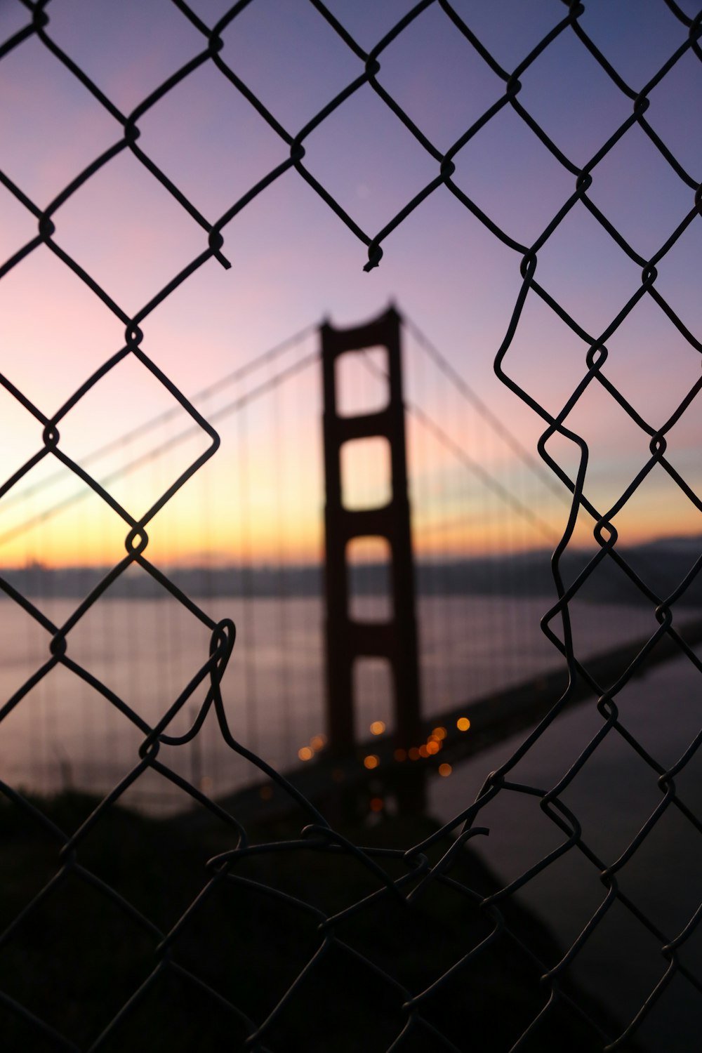 broken metal fence at night