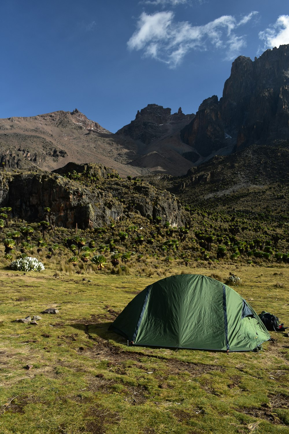 green dome tent near hills