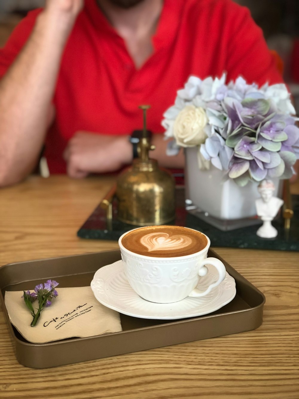 cup of heart latte on saucer