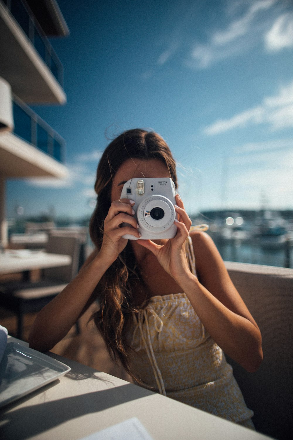 sitting woman using camera