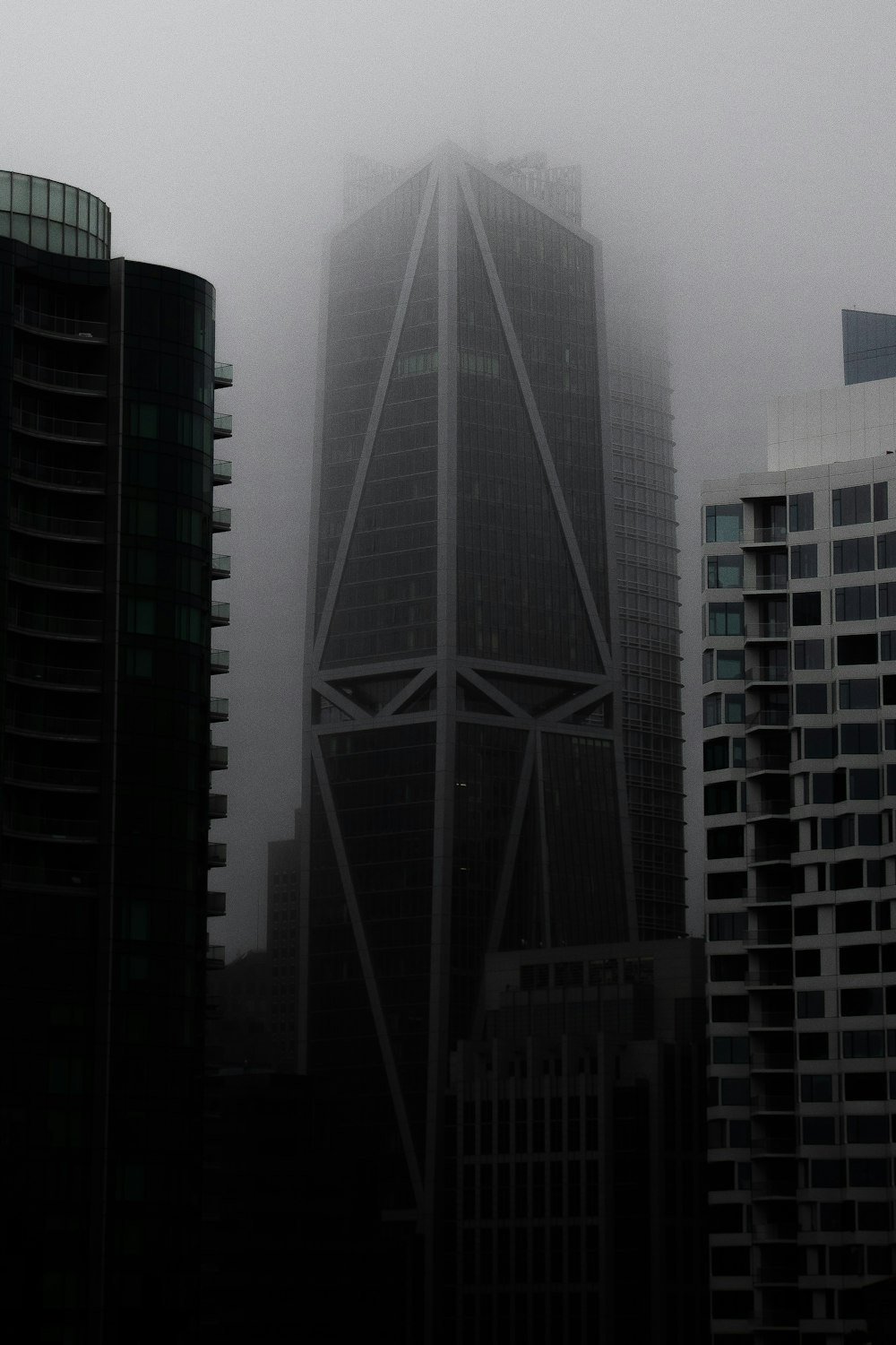 grayscale photo of high-rise buildings