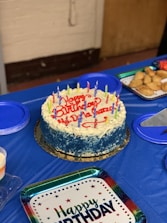 A festive birthday catering display with cake.