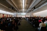 An engaging speaker presenting to an attentive audience.
