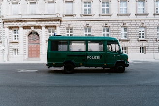 green bus on road