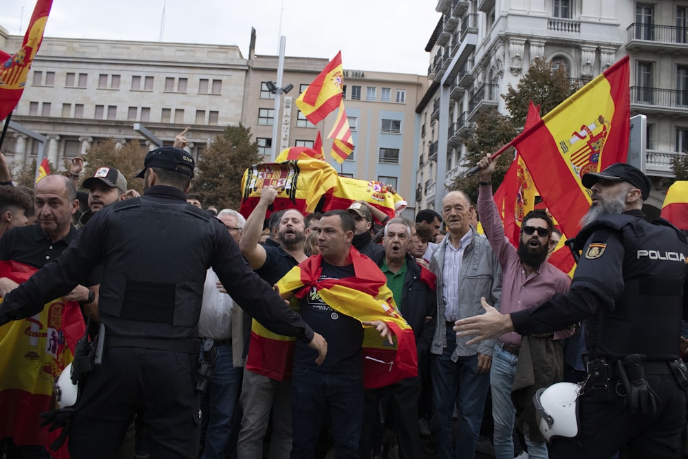 crowd raising flags