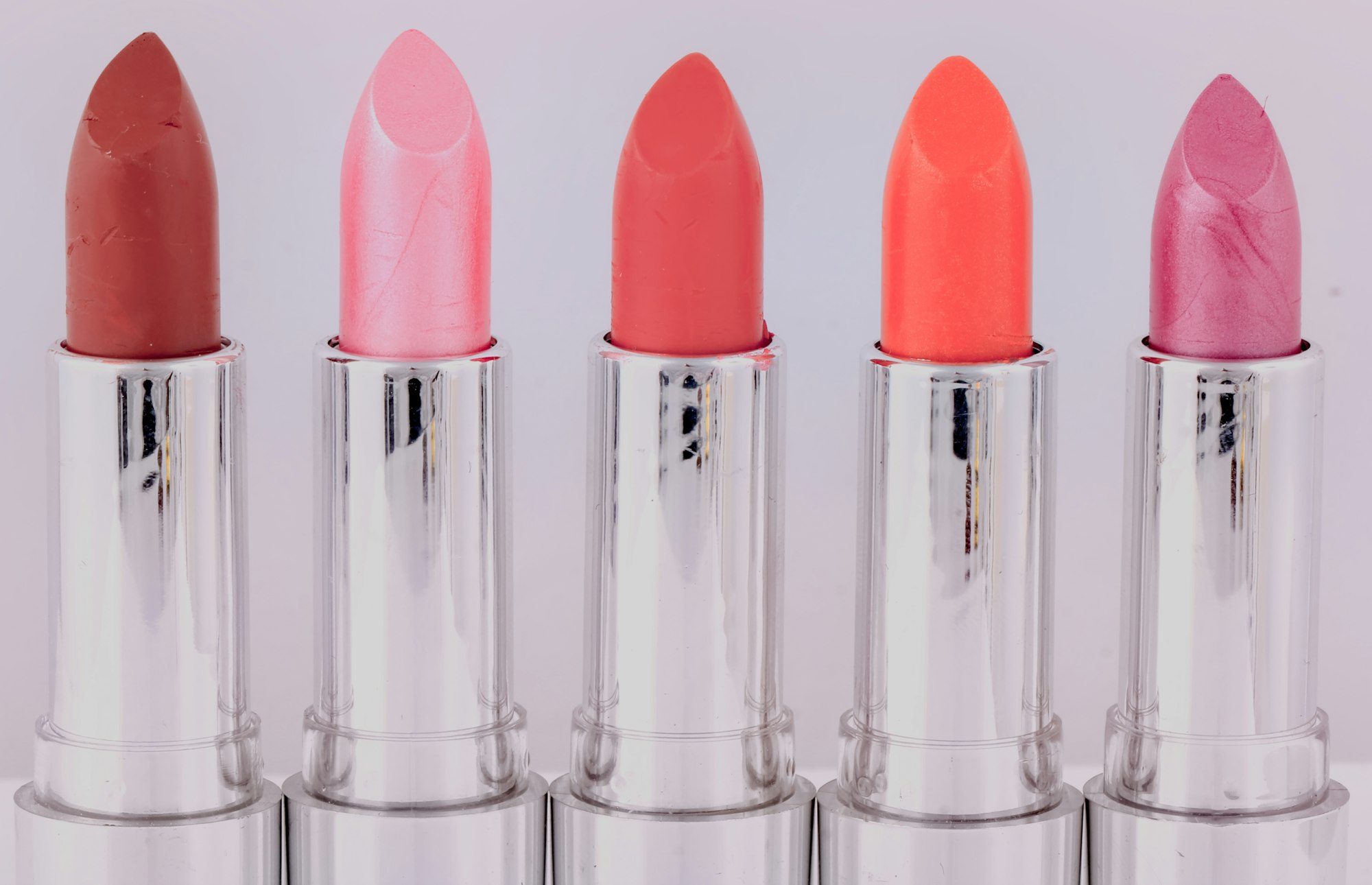 lipsticks, white, silver, background, plastic, red, pink, violet, brown, orange, together, row, abreast, parallel, side by side, side, cosmetics, beauty