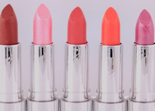 five assorted-color lipsticks