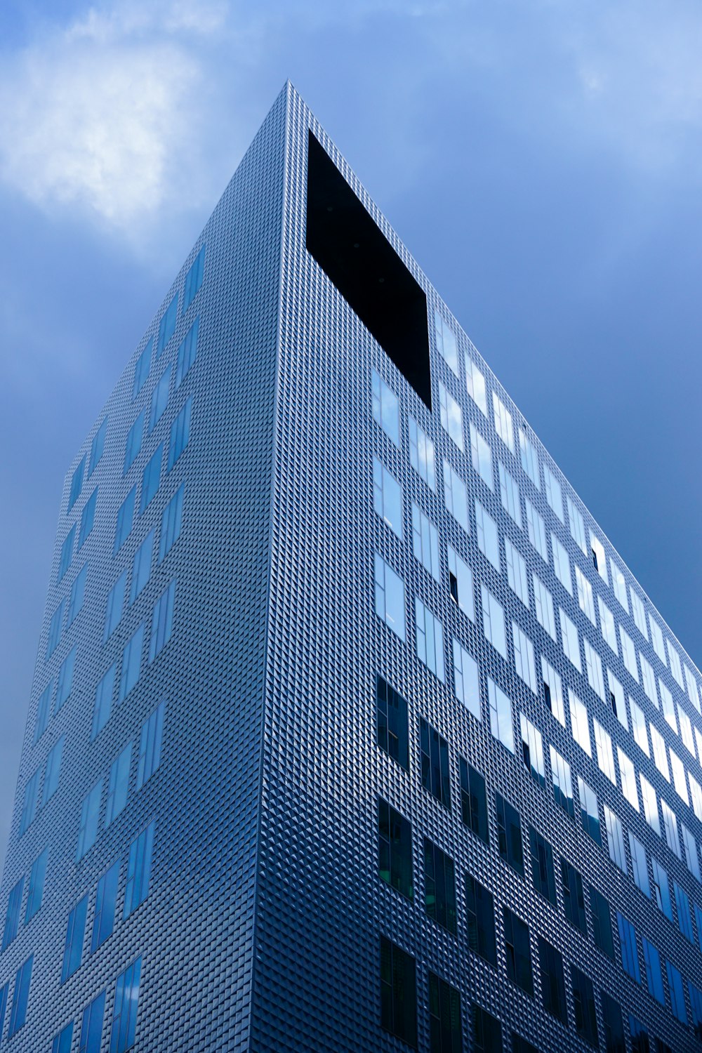 gray high-rise building under blue sky