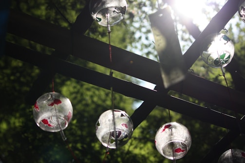 Wind chimes hanging gently, creating soothing sounds in the breeze.