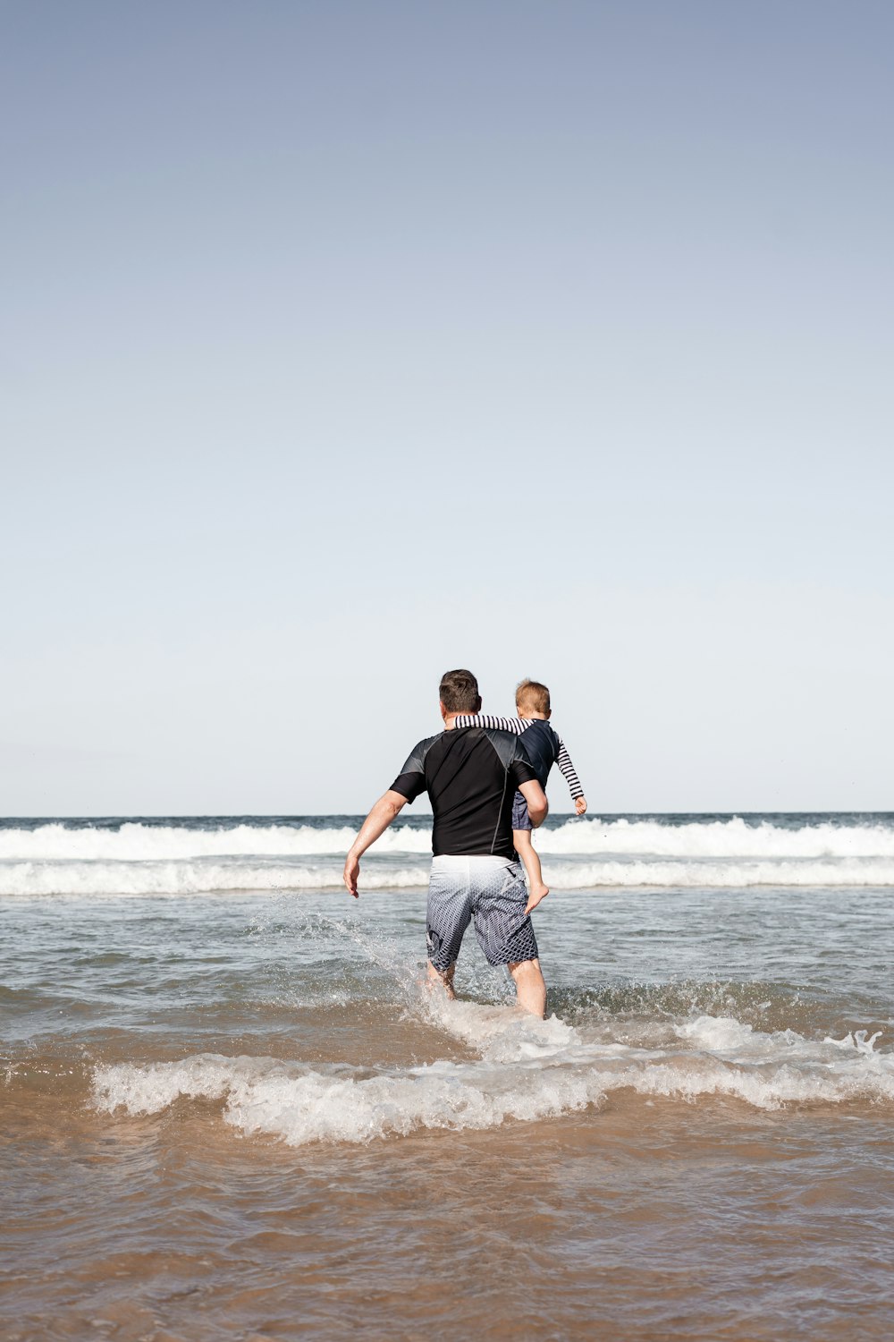 man walking on the seashore