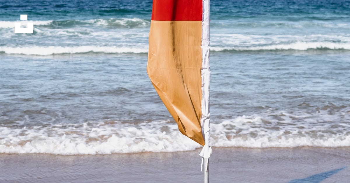 Orange and red flaglets on shore photo – Free Flag Image on Unsplash