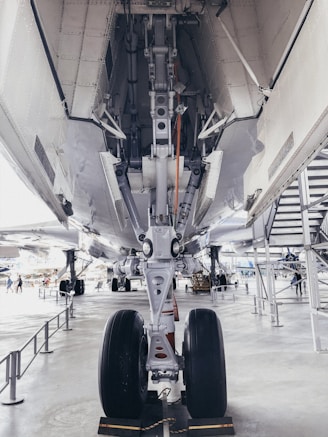 gray airplane on airfield during day