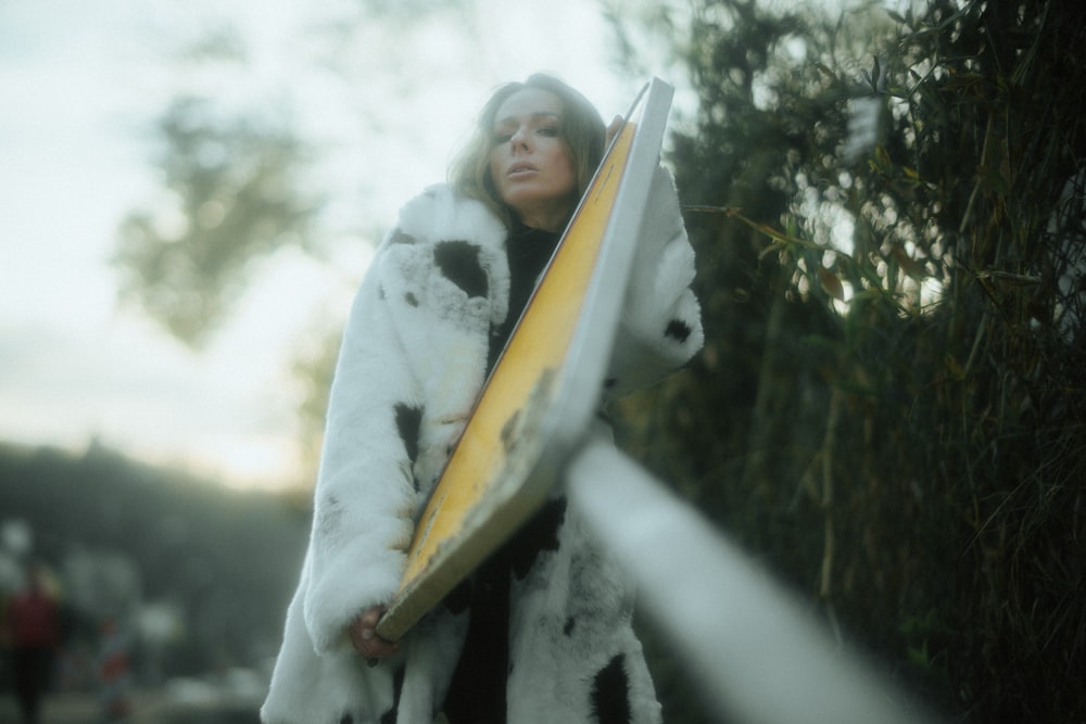 shallow focus photo of woman in white fur jacket