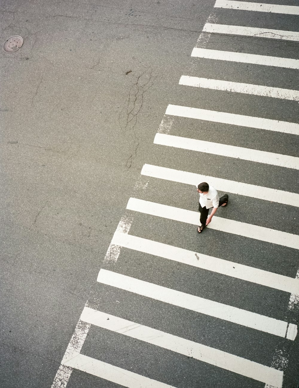 man walking on pedestrian top view