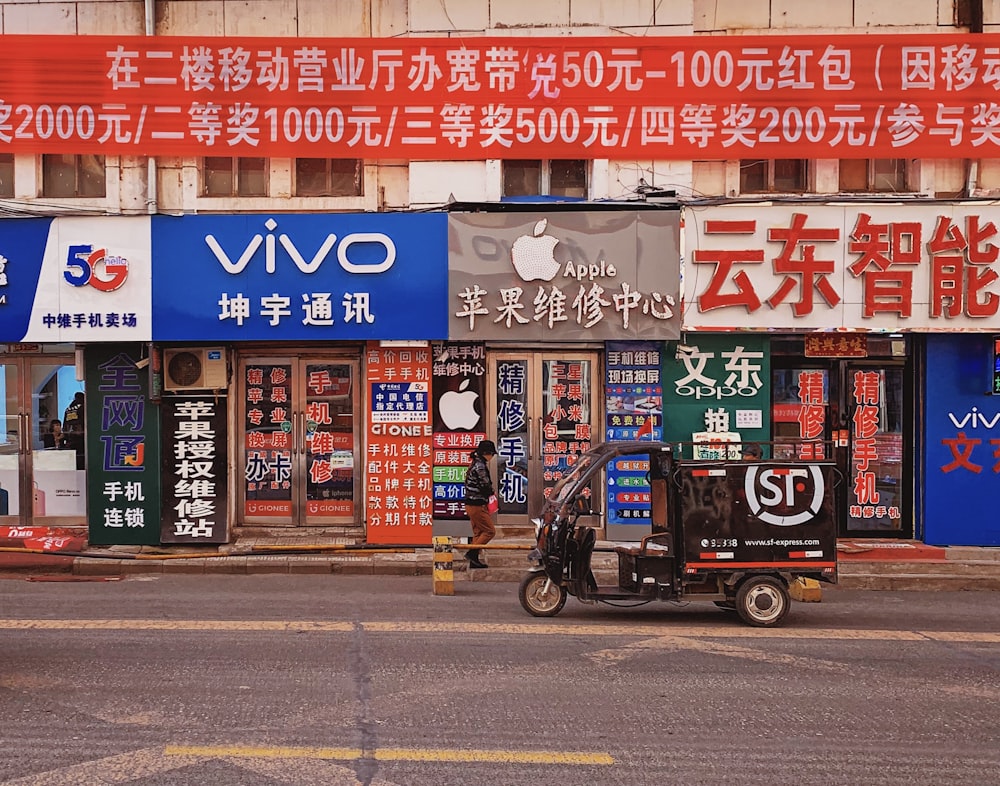 auto-rickshaw parked by road