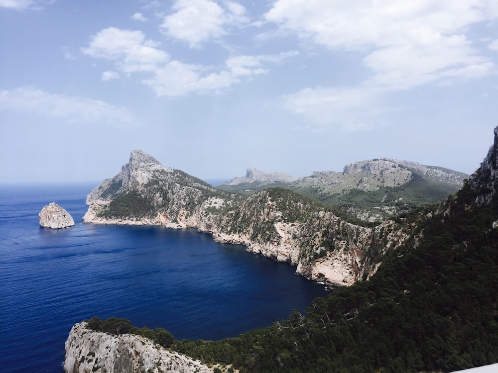 aerial photo of mountain near ocean